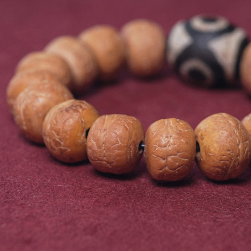 ATELIER-TIBET Bracelet Mala Bodhi 14 mm et Perles Dzi Artisanales La force symbolique des graines sacrées