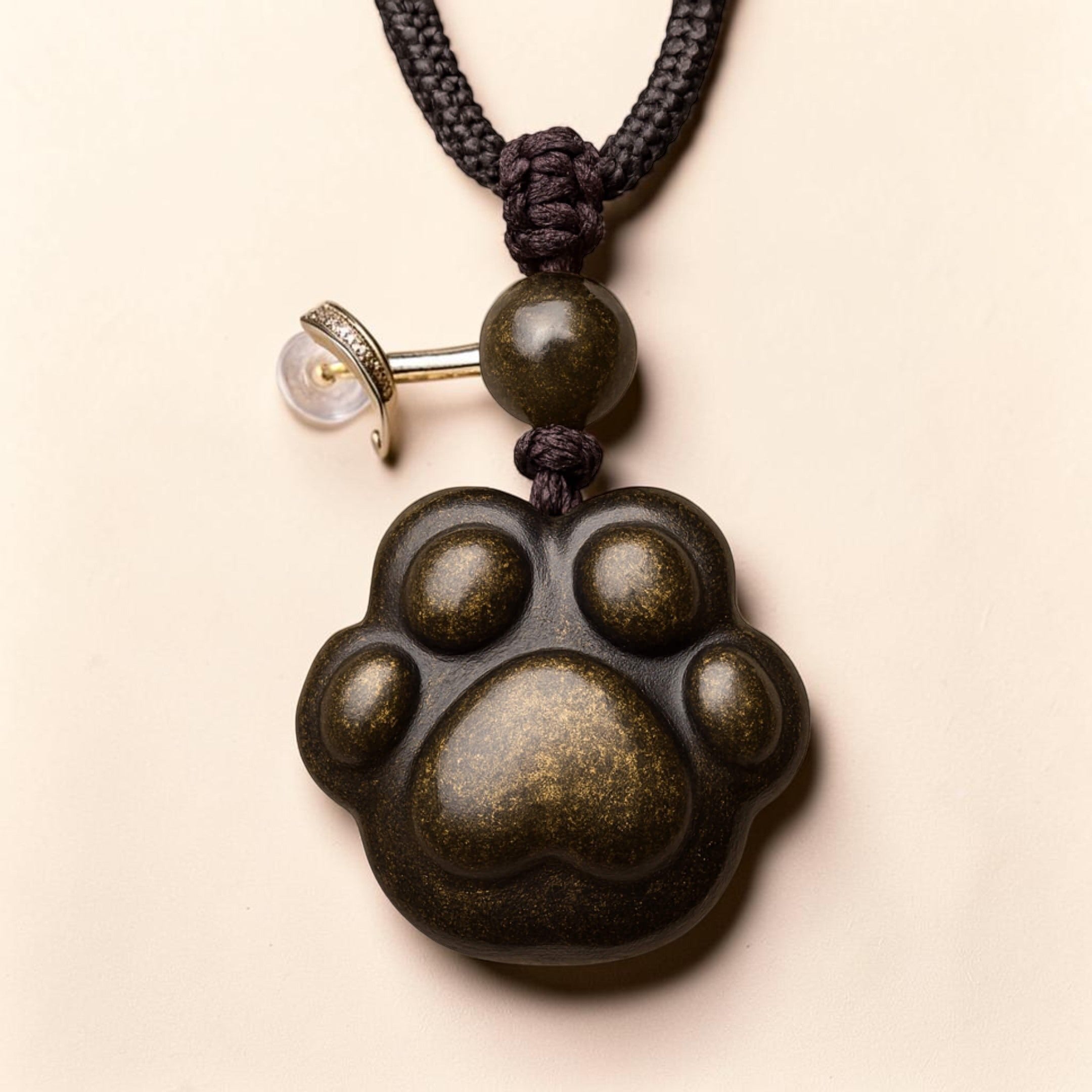 ATELIER-TIBET – Pendentif Patte Lien Éternel en Obsidienne Dorée