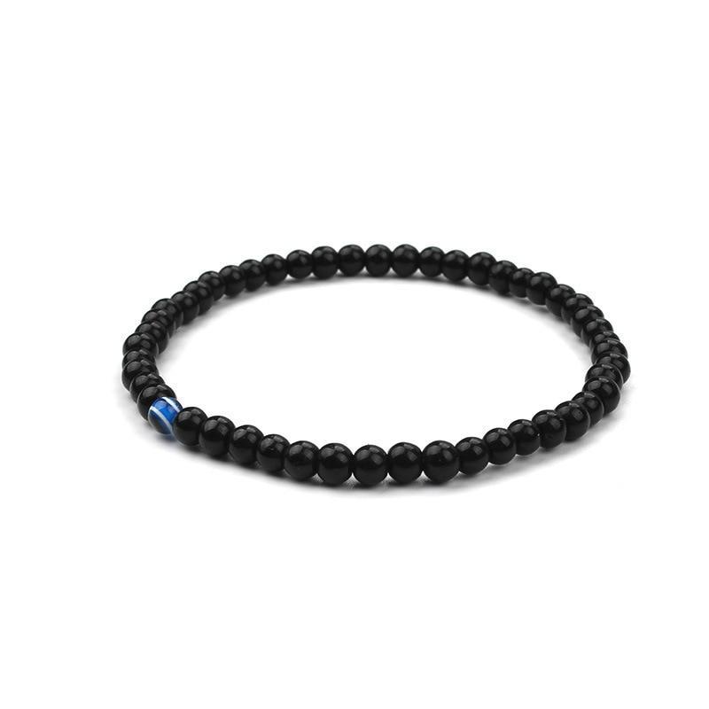 ATELIER-TIBET – Bracelet en Onyx Noir & Symbole du Mauvais Œil (Perles 4 mm)