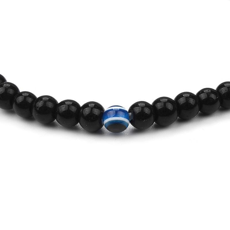 ATELIER-TIBET – Bracelet en Onyx Noir & Symbole du Mauvais Œil (Perles 4 mm)