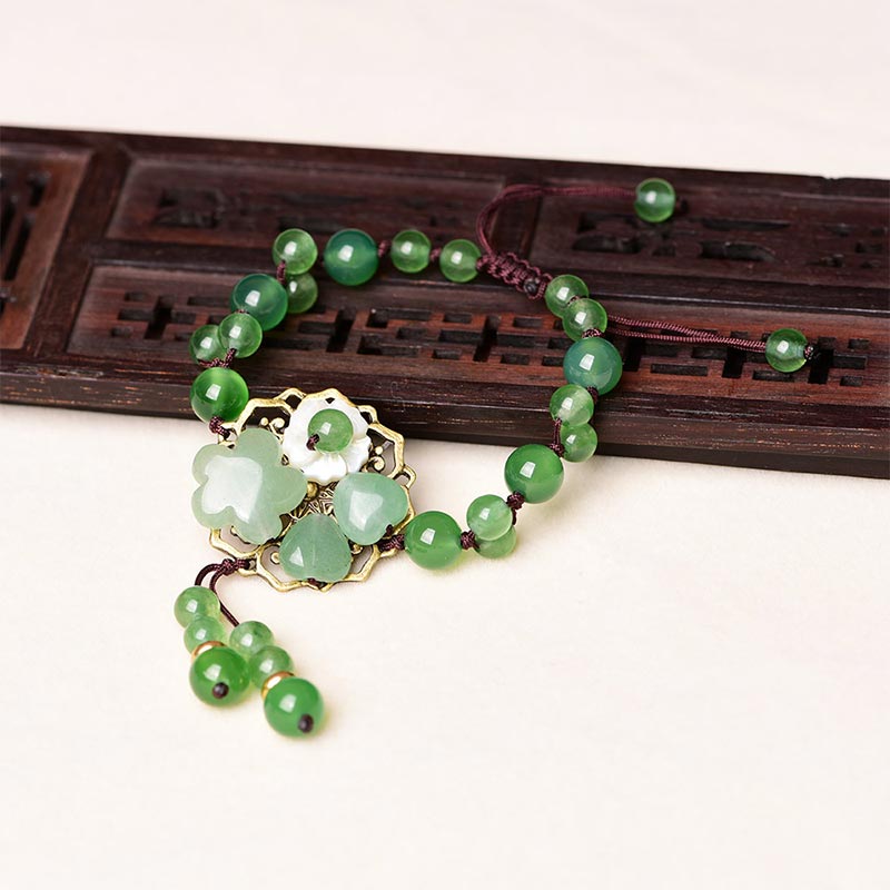 ATELIER-TIBET – Bracelet Porte-Bonheur en Jade Vert & Fleur Symbolique | Harmonie & Épanouissement
