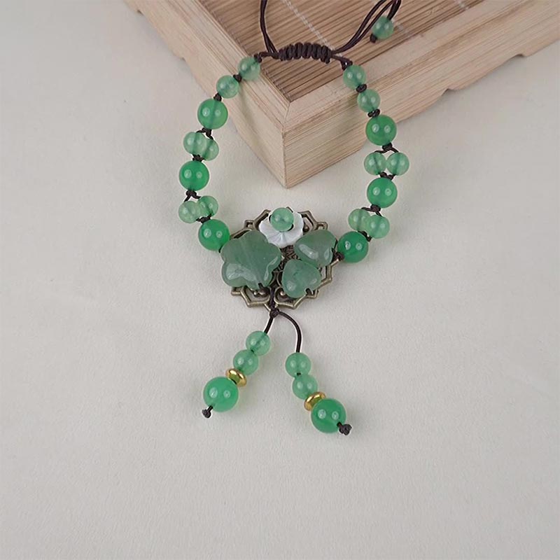 ATELIER-TIBET – Bracelet Porte-Bonheur en Jade Vert & Fleur Symbolique | Harmonie & Épanouissement