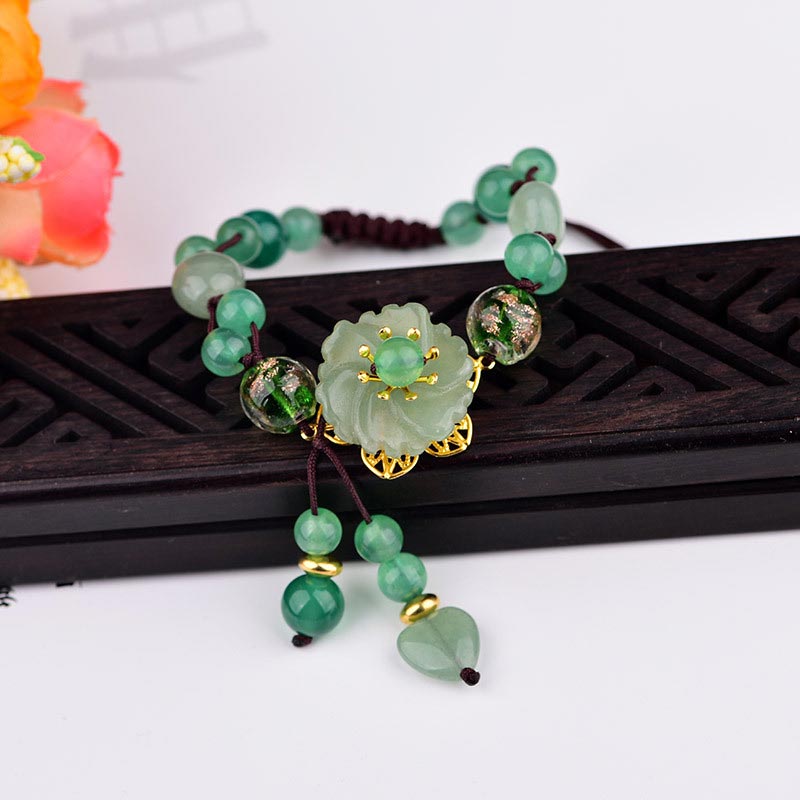 ATELIER-TIBET – Bracelet Porte-Bonheur en Jade Vert & Fleur Symbolique | Harmonie & Épanouissement